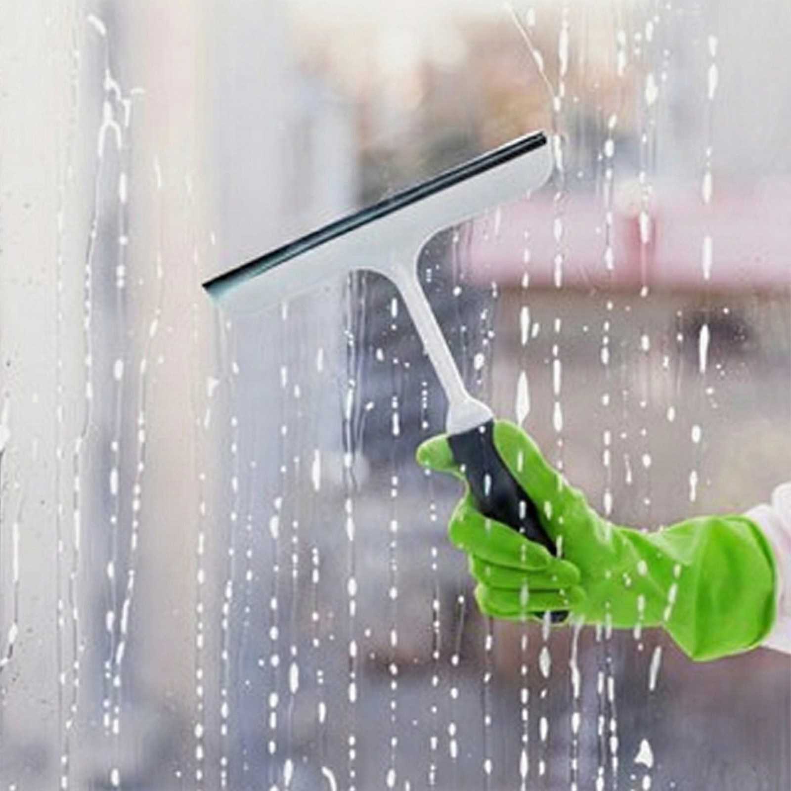 professional cleaner wiping kitchen counter West London